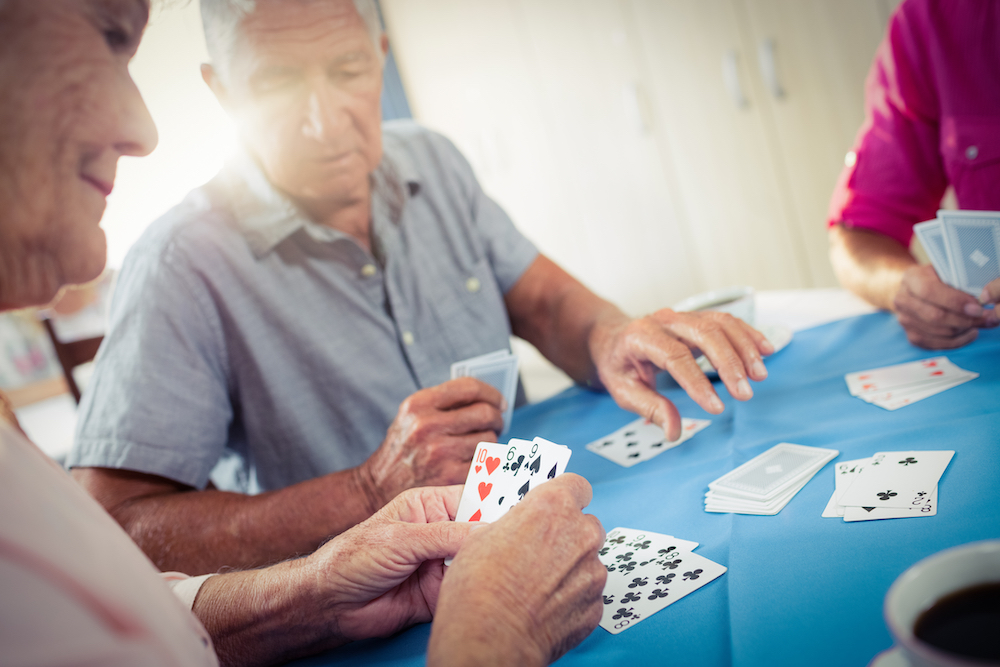Seniors enjoy playing a card game